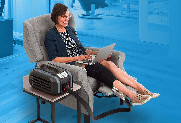 woman in a chair doing work while recovering