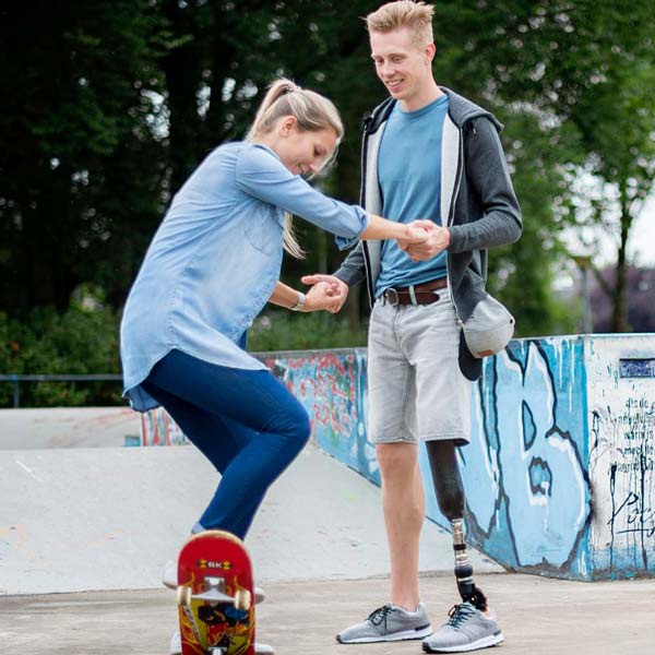 A person wearing Pro-Flex® XC Torsion helps a girl in New York, New Jersey, & Connecticut