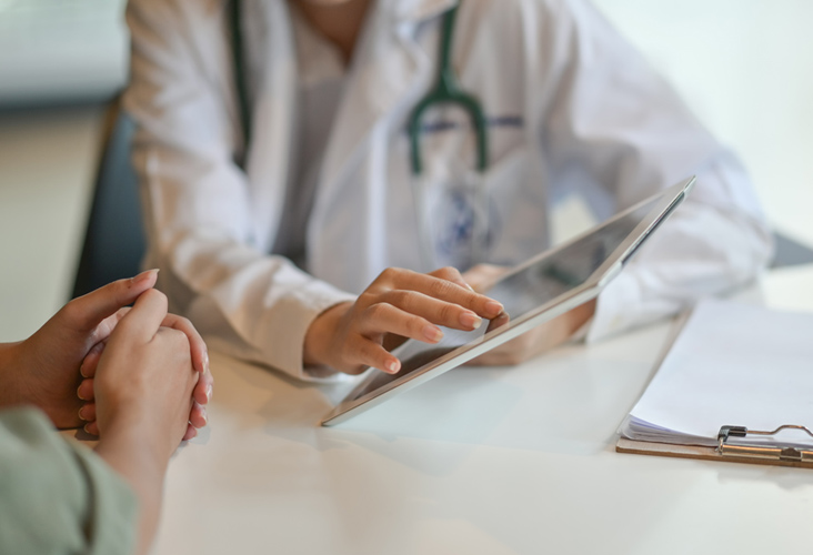 doctor helping patient with forms